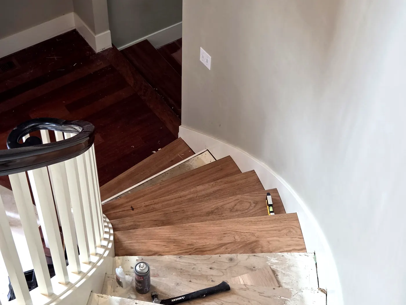 A curved staircase part way through its rebuild