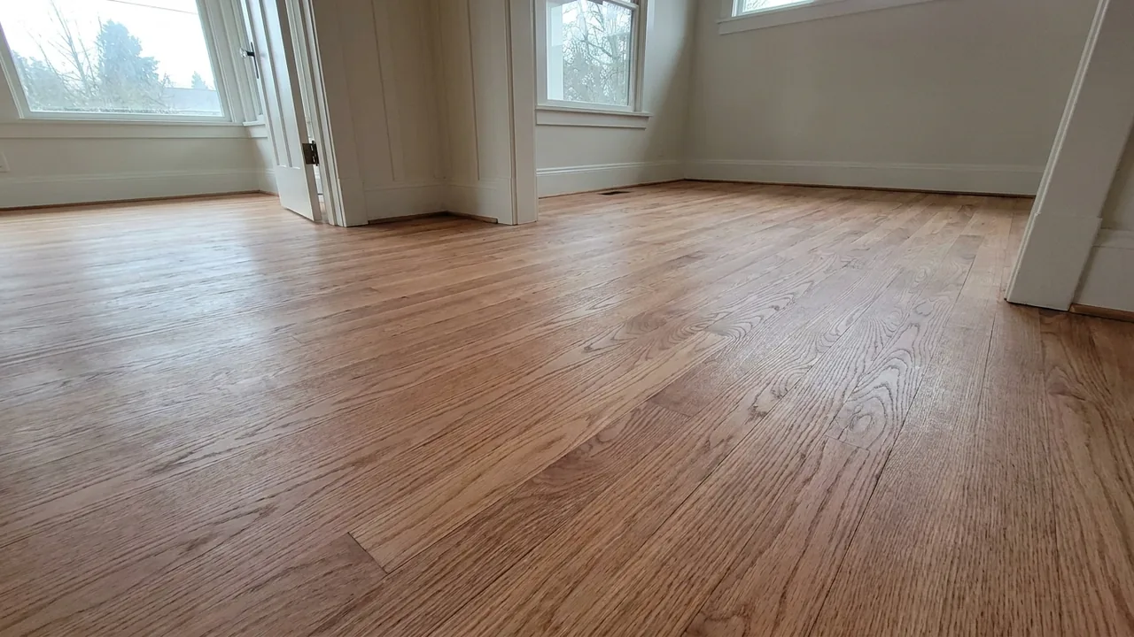 Freshly refinished white oak floor in a large open living room