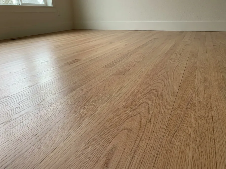 Red oak strip flooring, sanded and finished on site